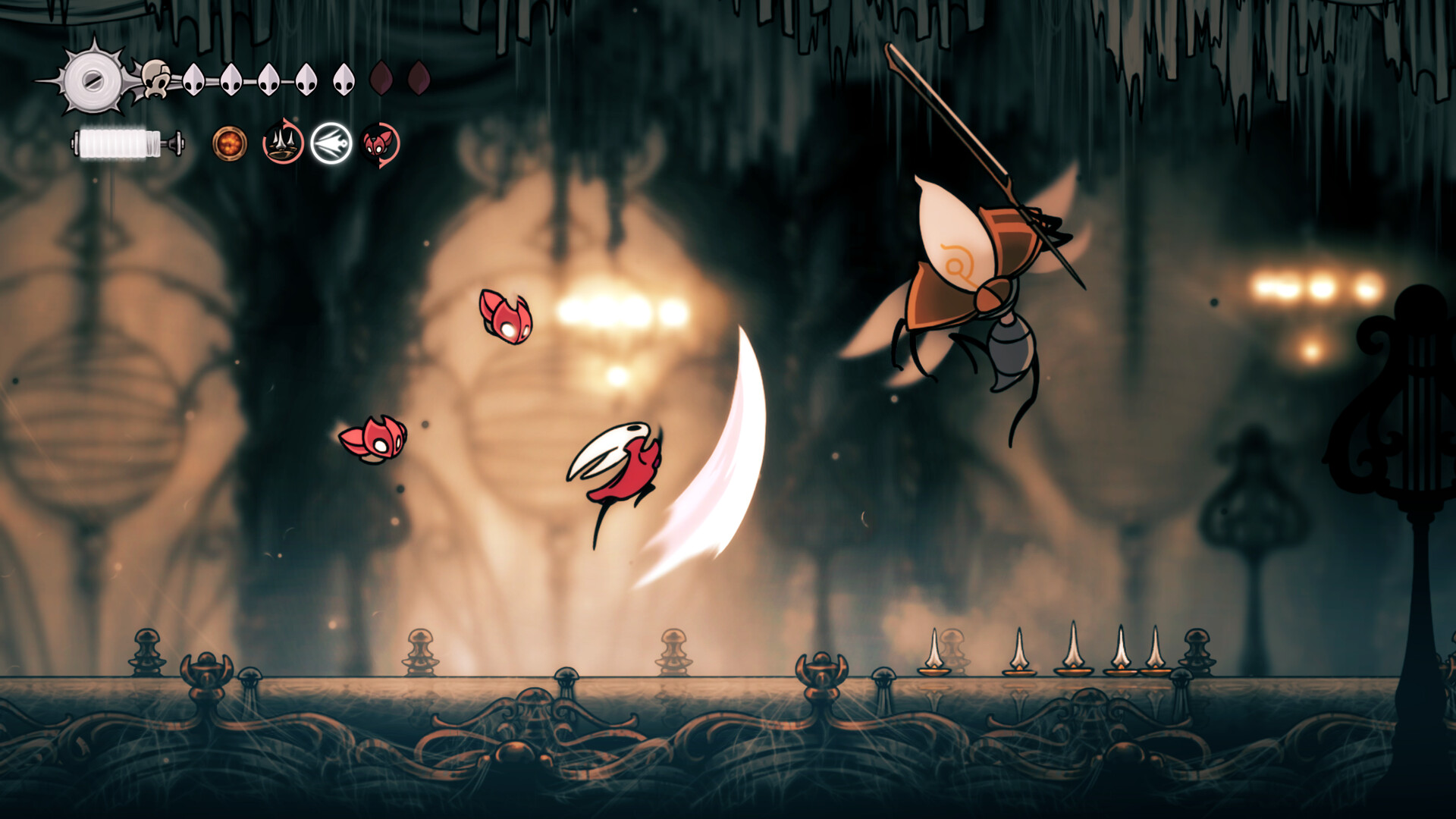 Hornet swings her needle in mid-air at a winged spear-carrying insect enemy, with two small red fliers nearby in a warmly lit hall